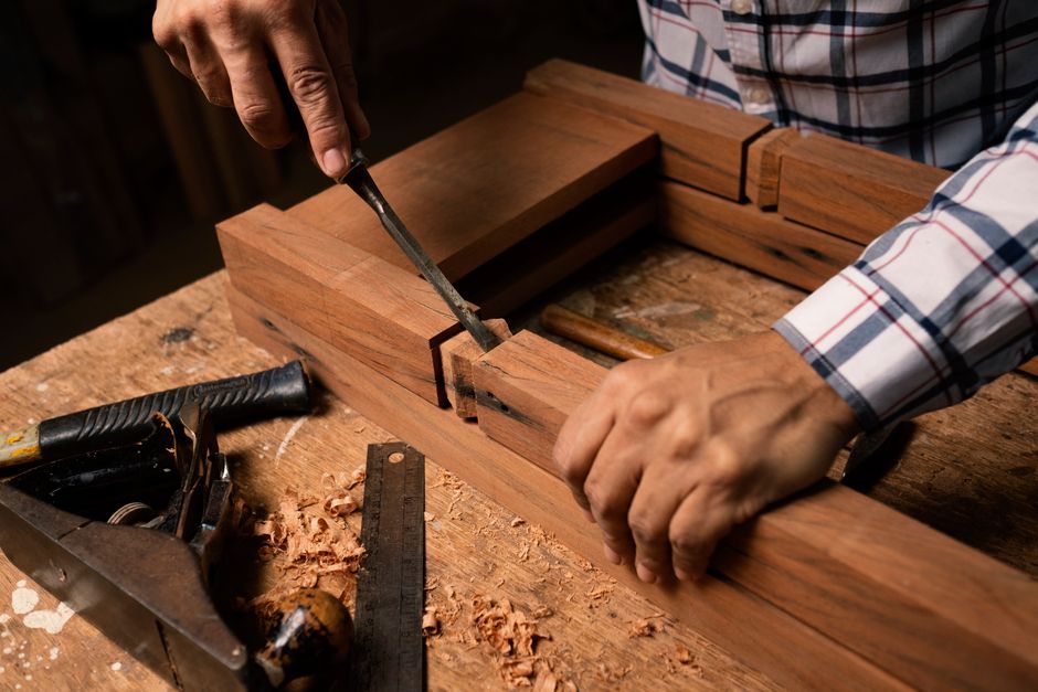 Detail of a custom dining table edge and woodworking tools