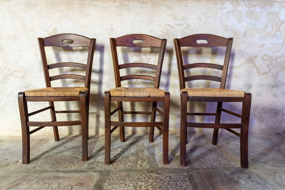 A beautifully crafted custom wooden chair with structural details