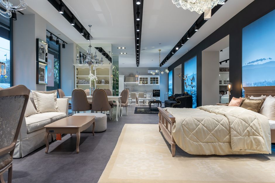 A view of a modern wooden furniture showroom displaying case goods